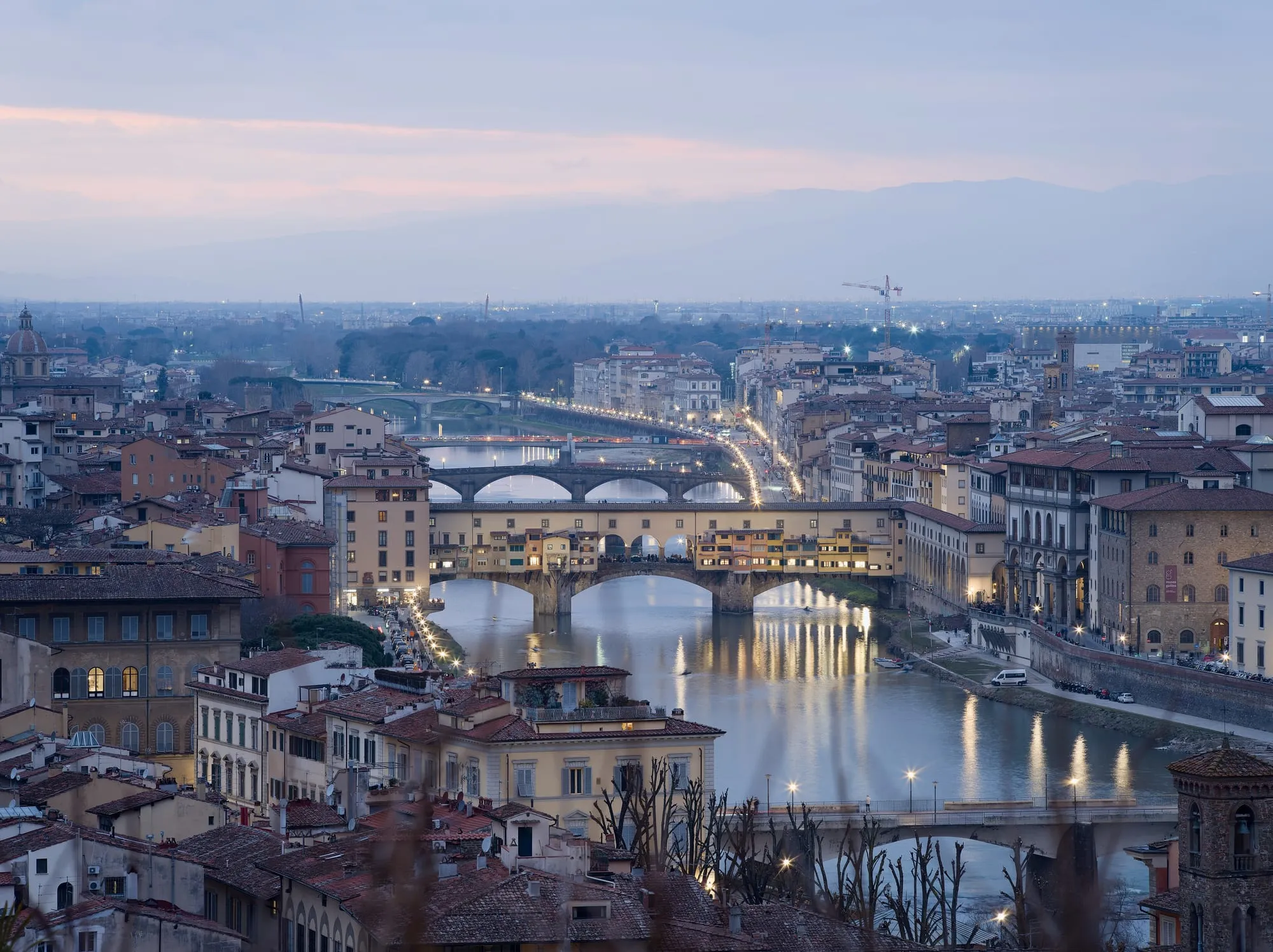 Ponte Vecchio and the Arno in Florence at blue hour, seen from Piazzale Michelangelo