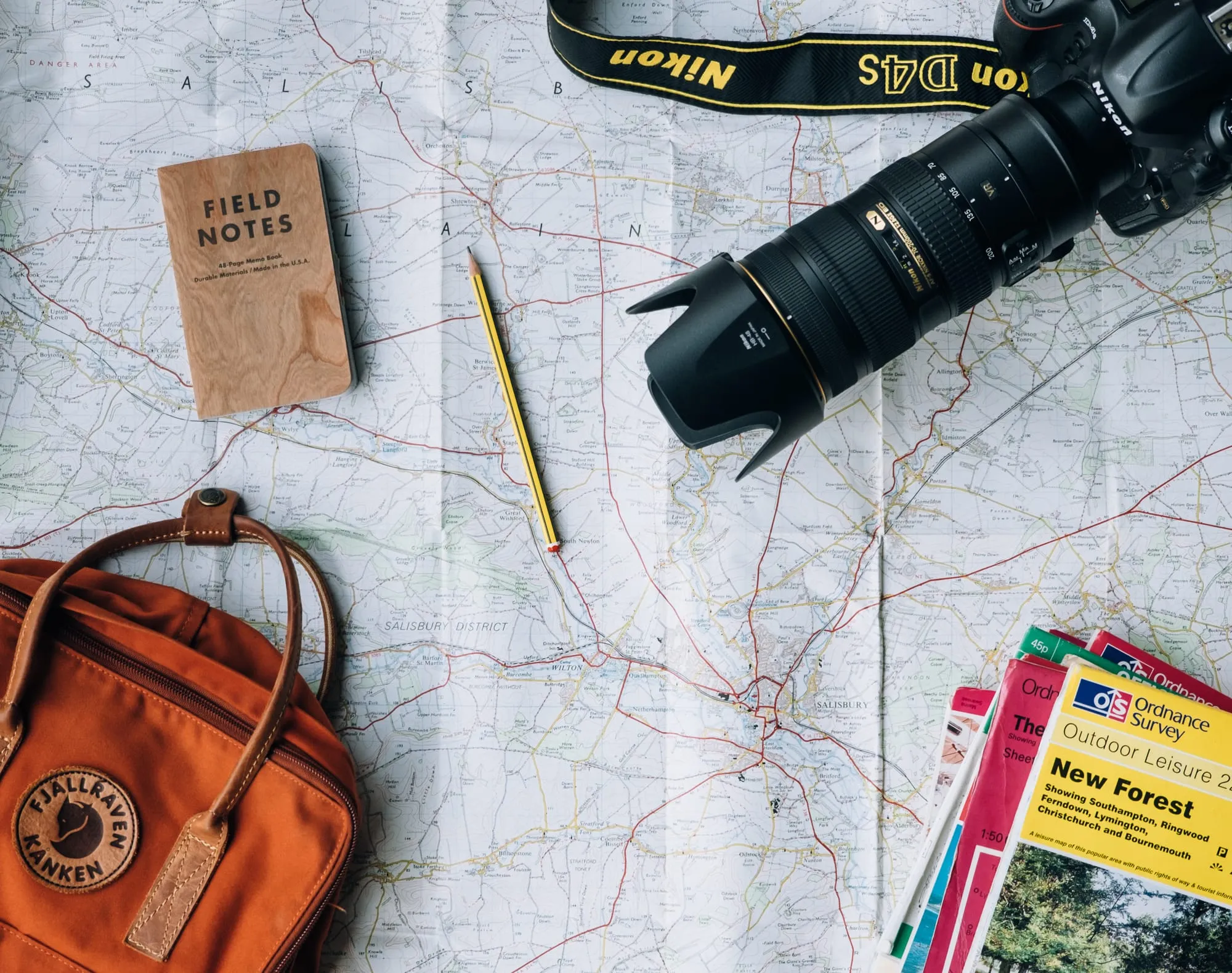 Map and travel notebook on a table